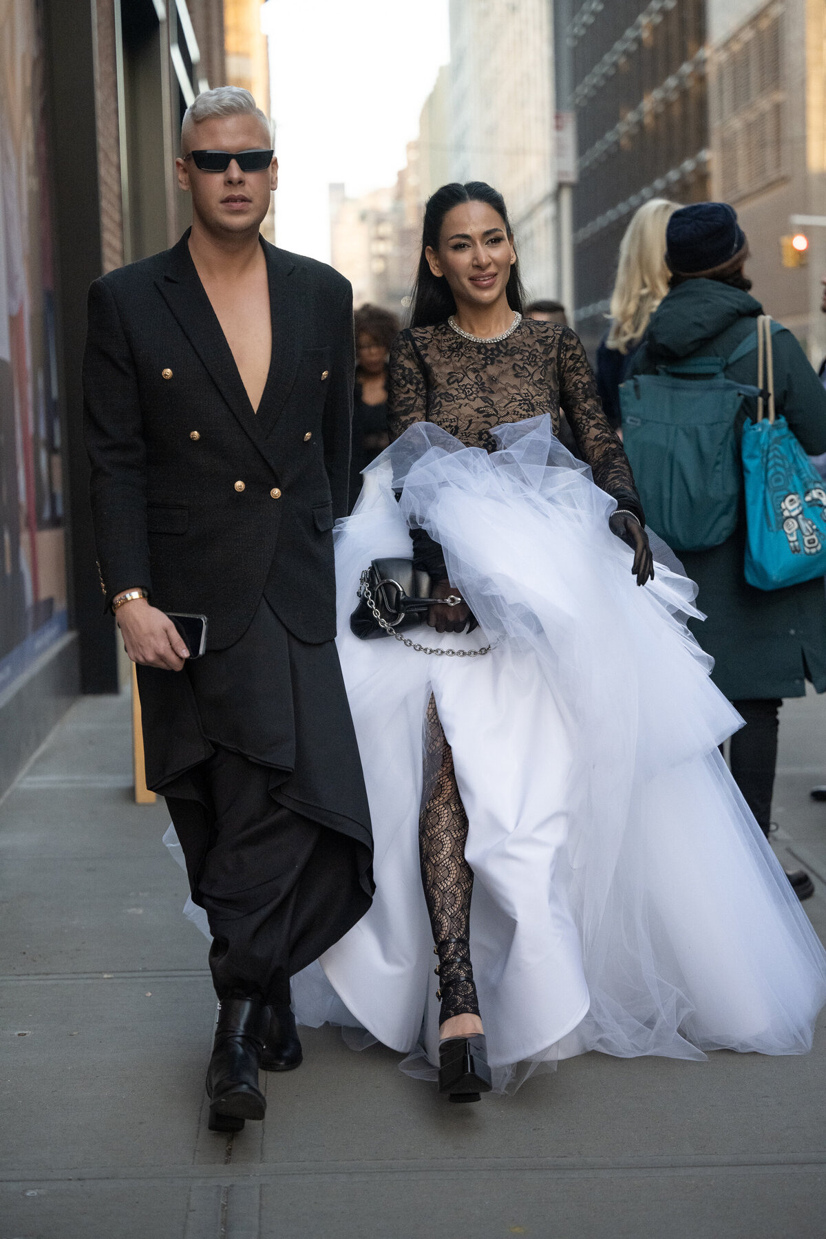 couple walking in wedding dress