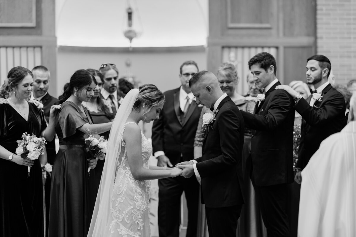 Black and white photo of bride and groomsmen