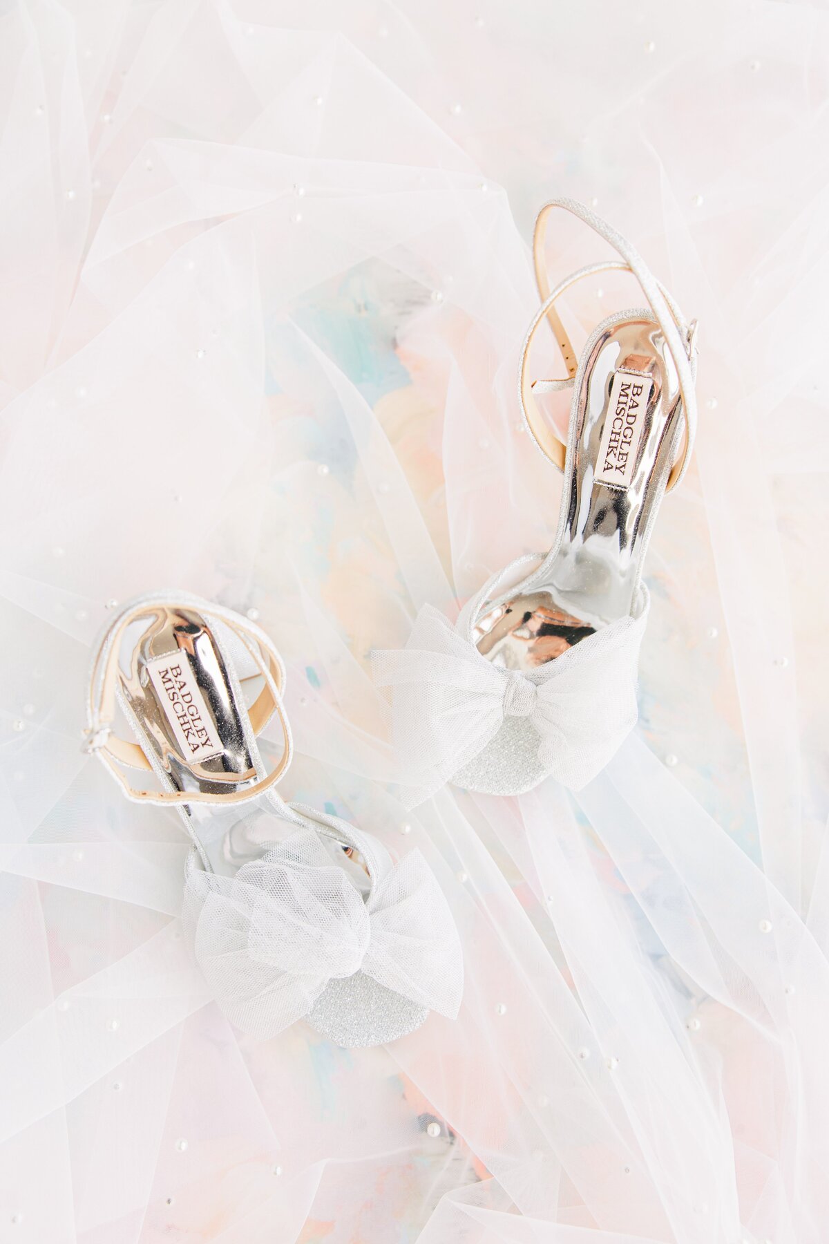 Silver wedding shoes with a wedding veil representing beautiful Boston wedding photography