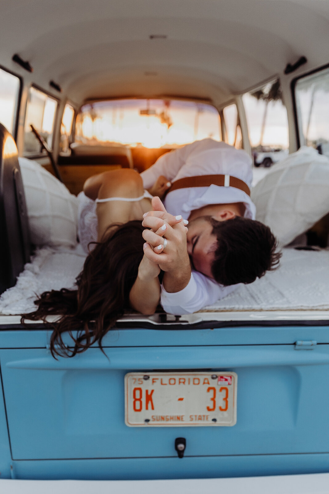 couple at sunset cuddling after their florida elopement