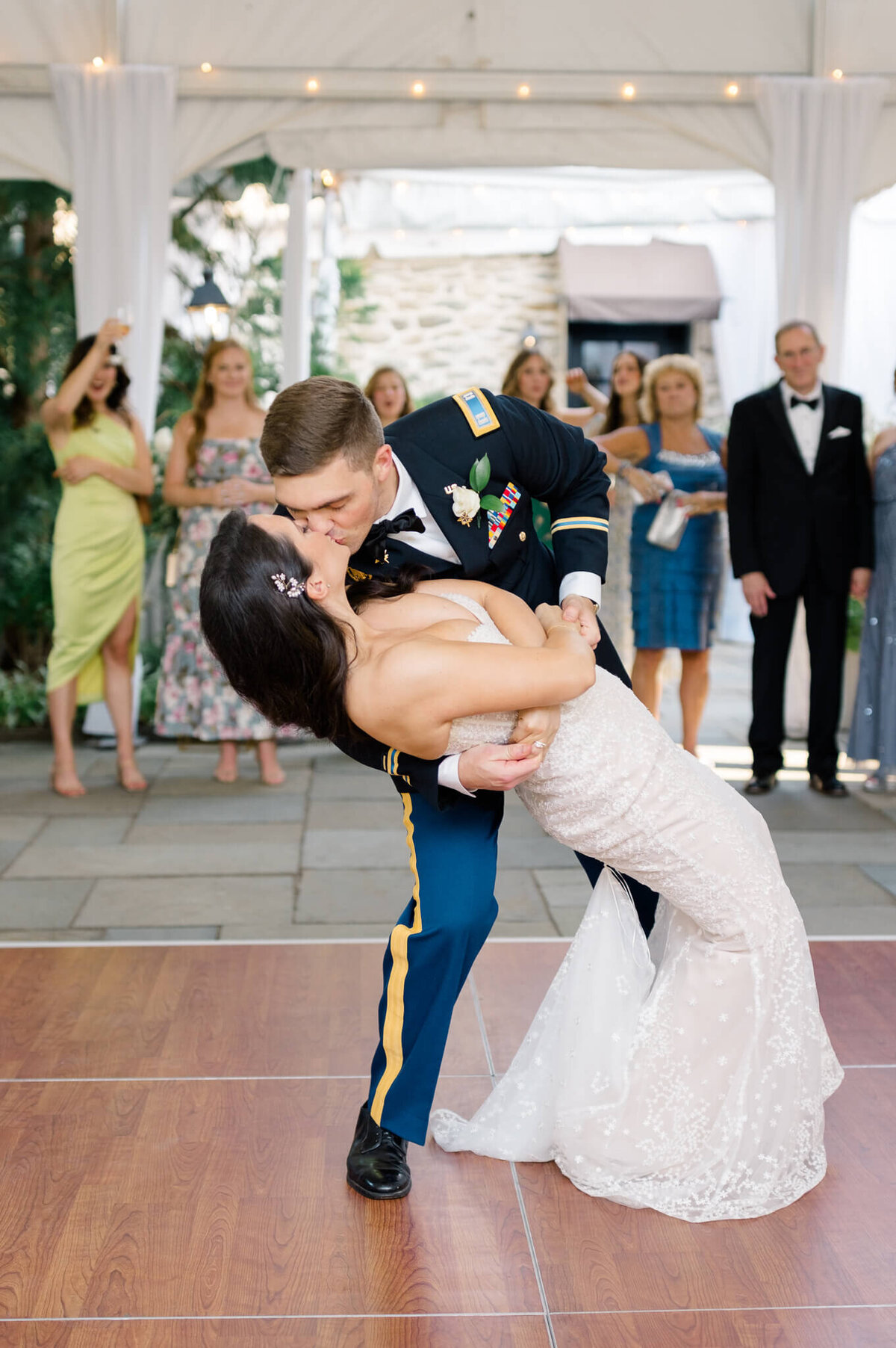 Groom dipping bride for a kiss during their first dance at The Red Fox Inn and Tavern. Taken by Washington DC Wedding Photographer Bethany Aubre Photography.