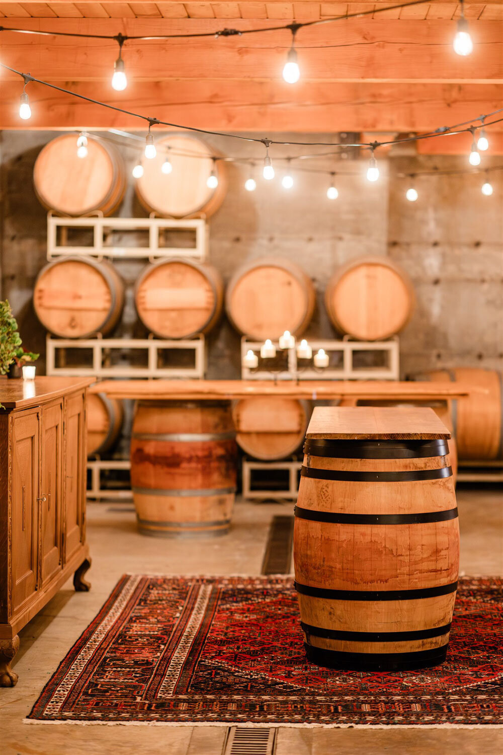 The Barrel room at Chateau Lill full of wine barrels