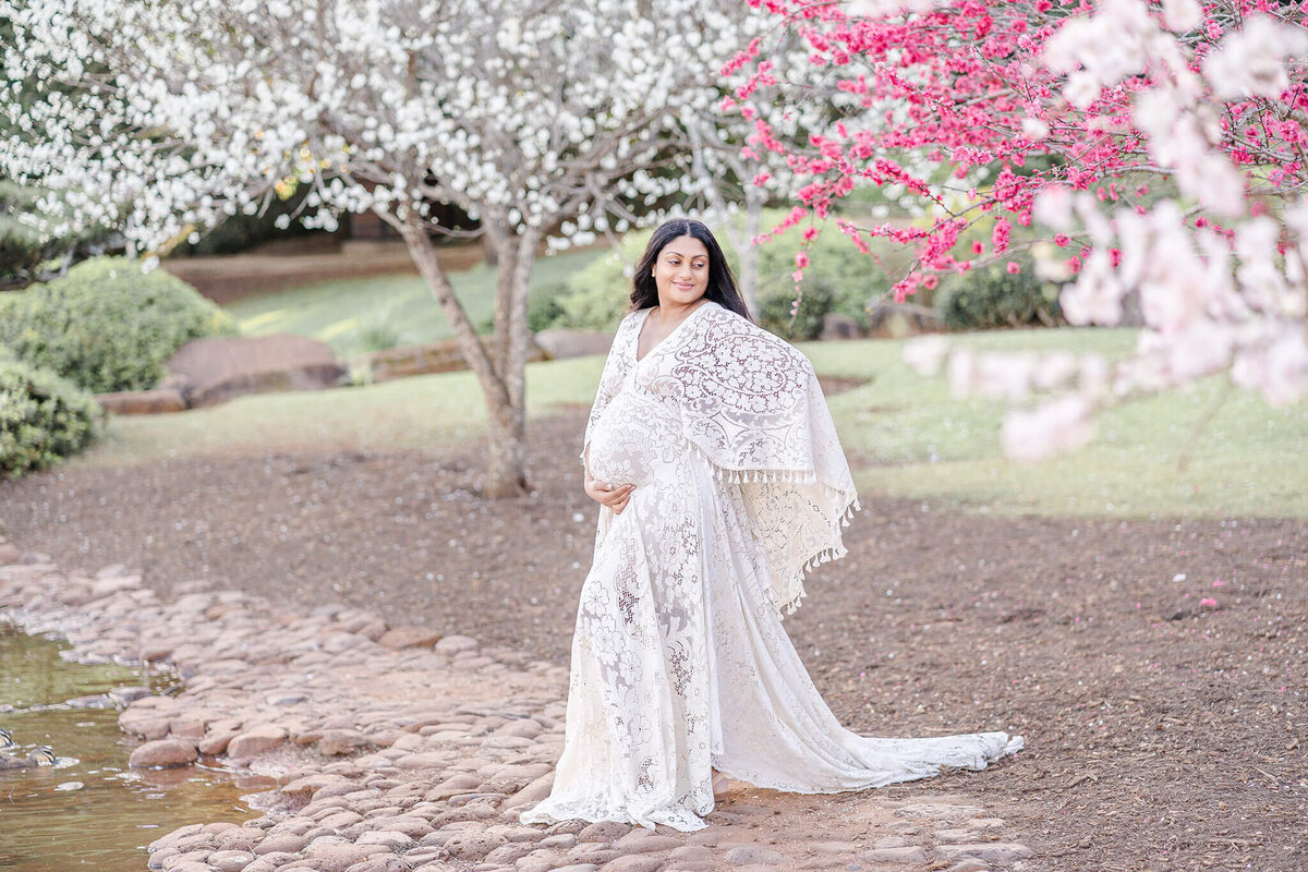 Radiate in the grace of an expectant mum during a maternity photoshoot at Brisbane's cherry blossoms.