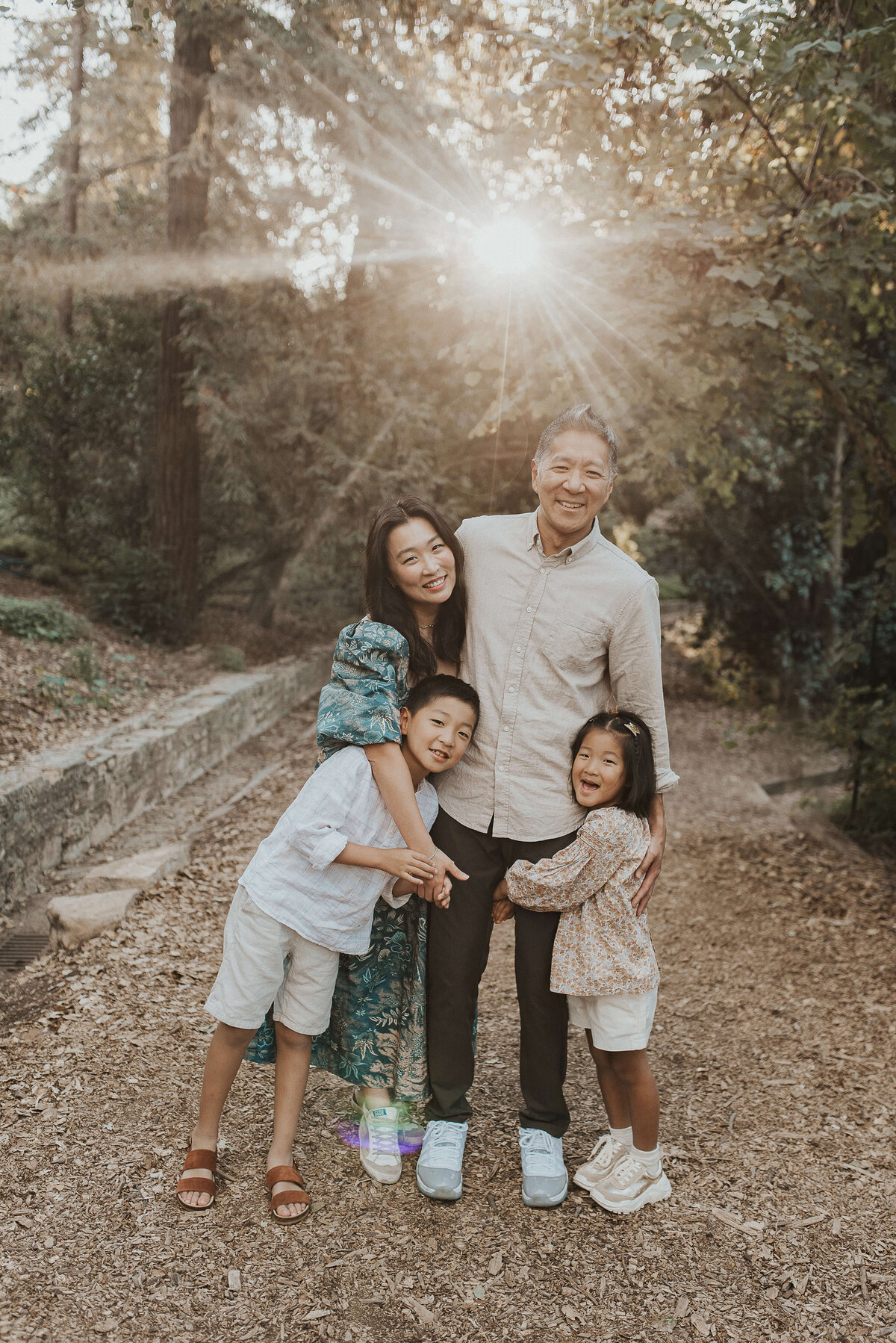 Family_With_Sun_Poking_Through_Trees