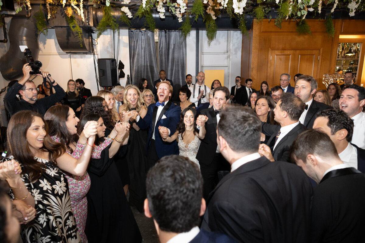 a wide shot of the rowdy dance floor during the horah