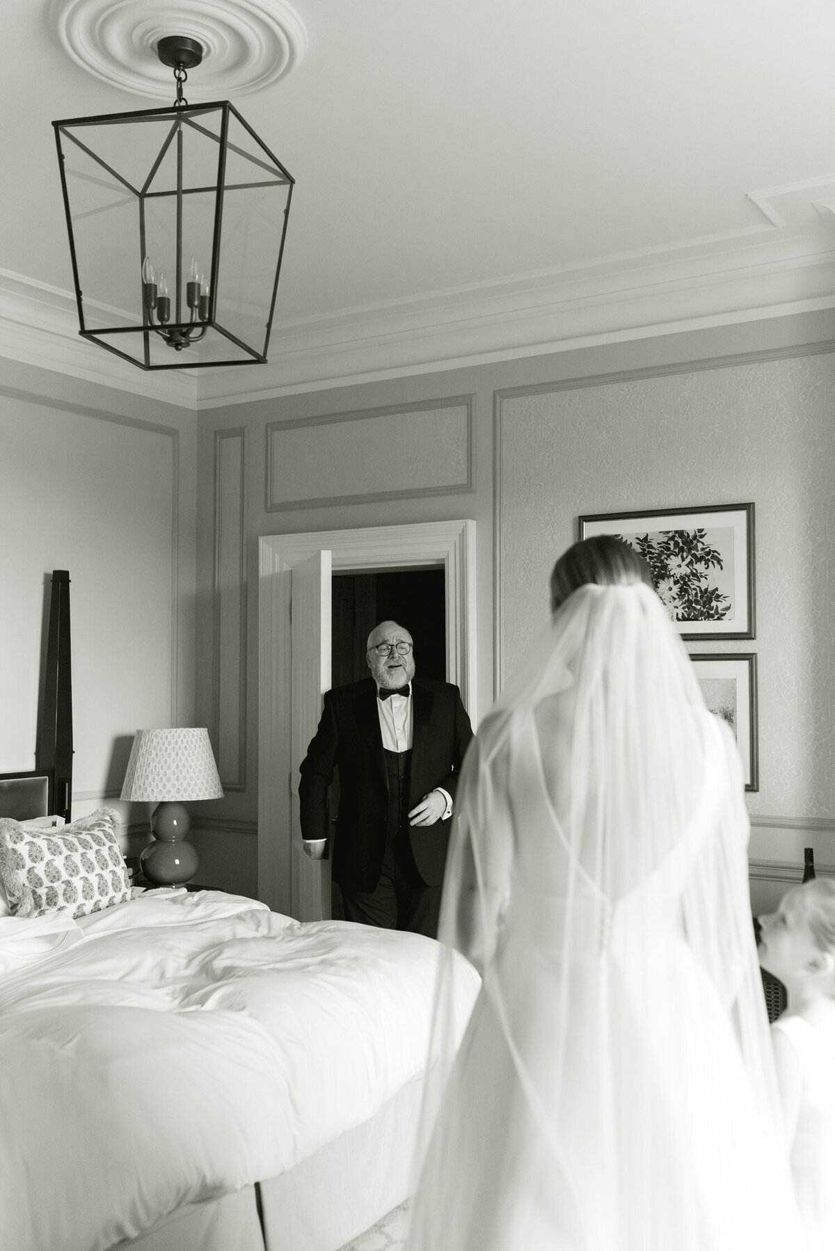 Emotive black and white image of a Father seeing his daughter for the first time on the morning of her Gleneagles wedding.  Image by Scotland wedding photographer, Jill Cherry Porter.