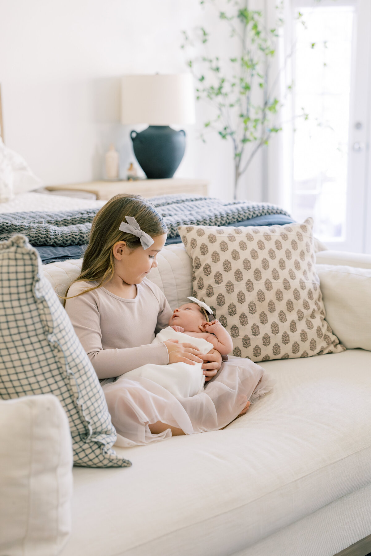 Charlotte newborn photographer cozy lifestyle newborn session with parents by window