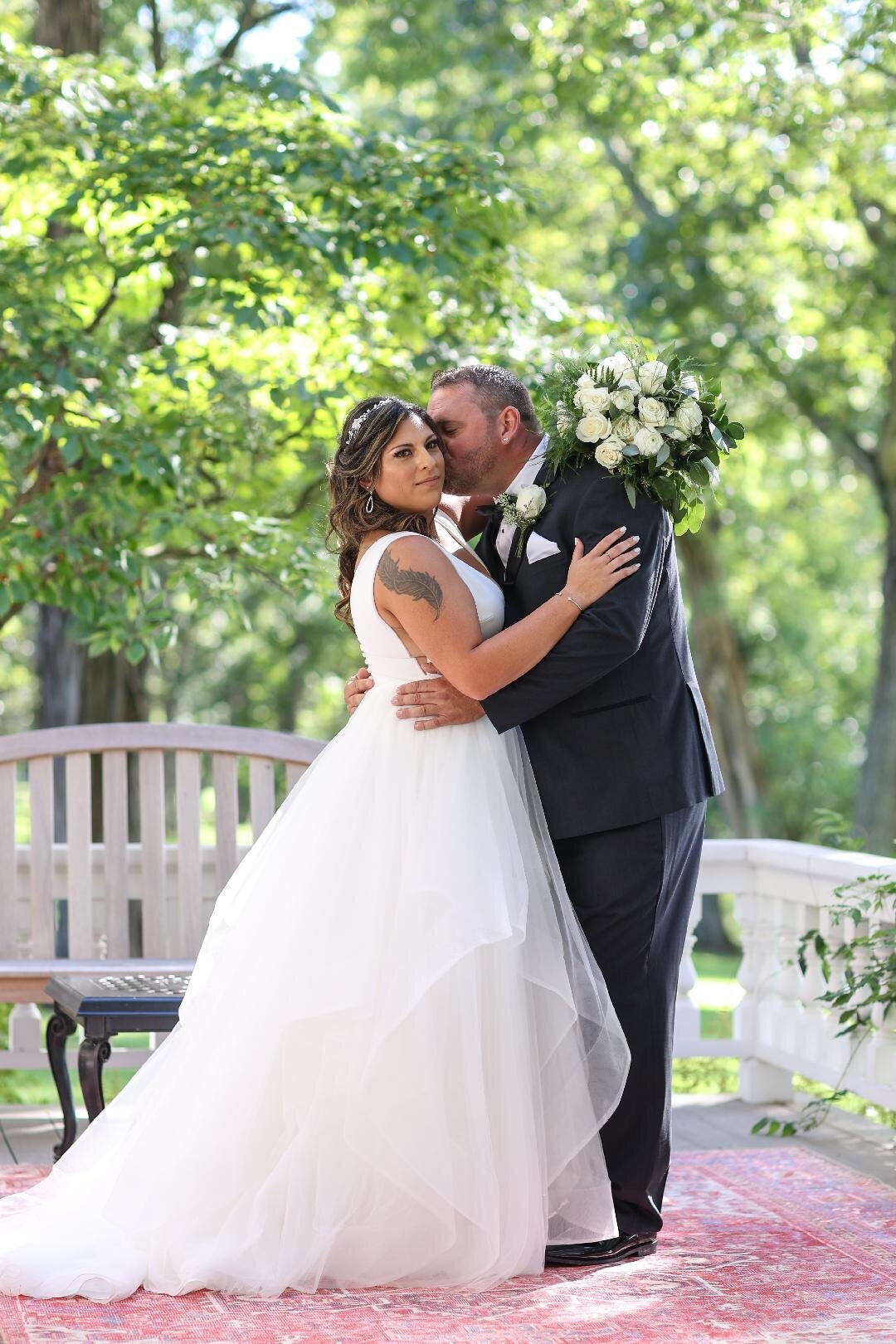 husband kissing her bride