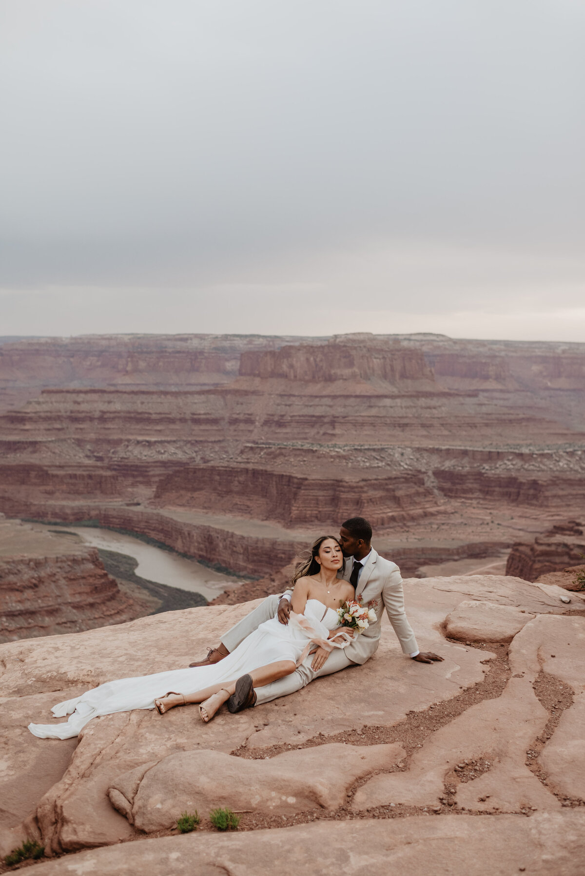 Utah Elopement Photographer captures groom kissing bride's forehead