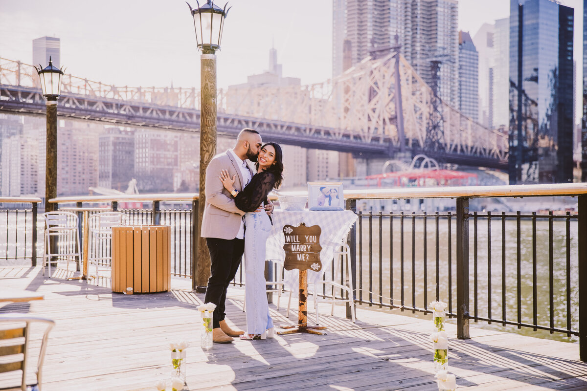 An engaged couple after their proposal at roosevelt island in nyc