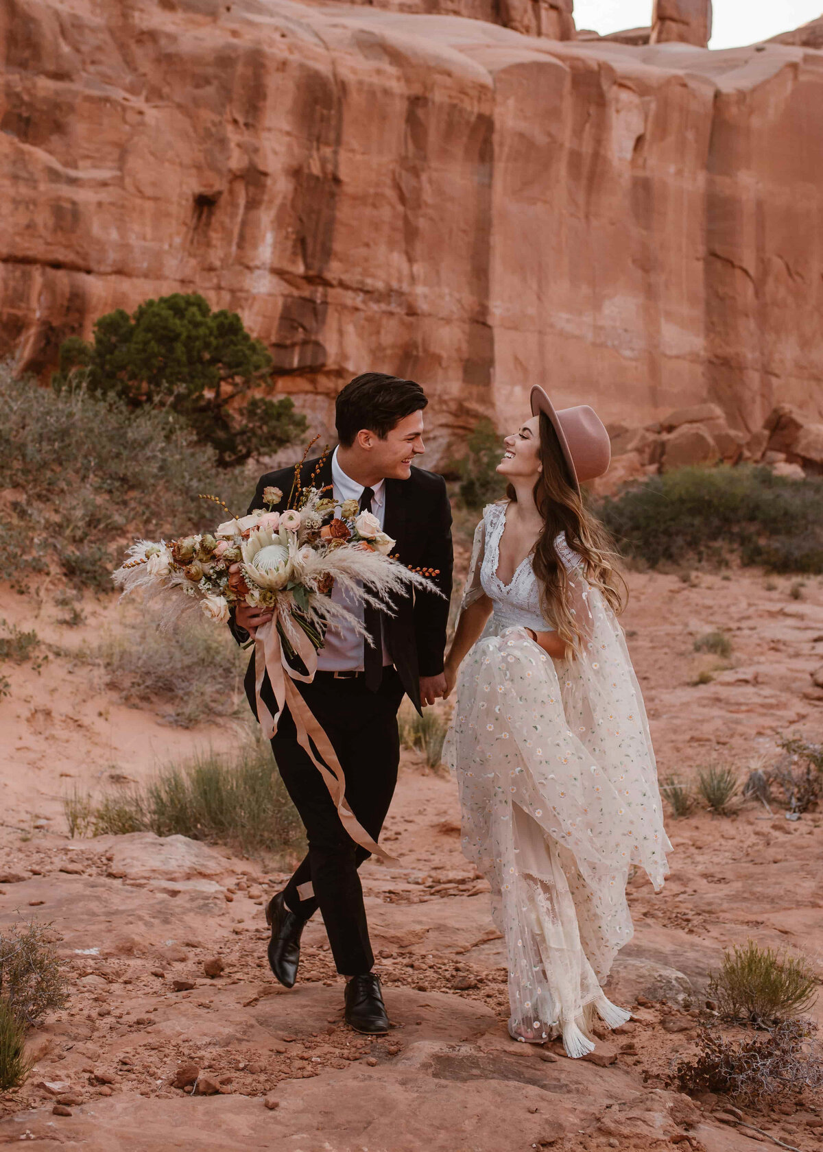 Couple shares an intimate moment among the red rock formations during their Garden of the Gods, Colorado elopement.