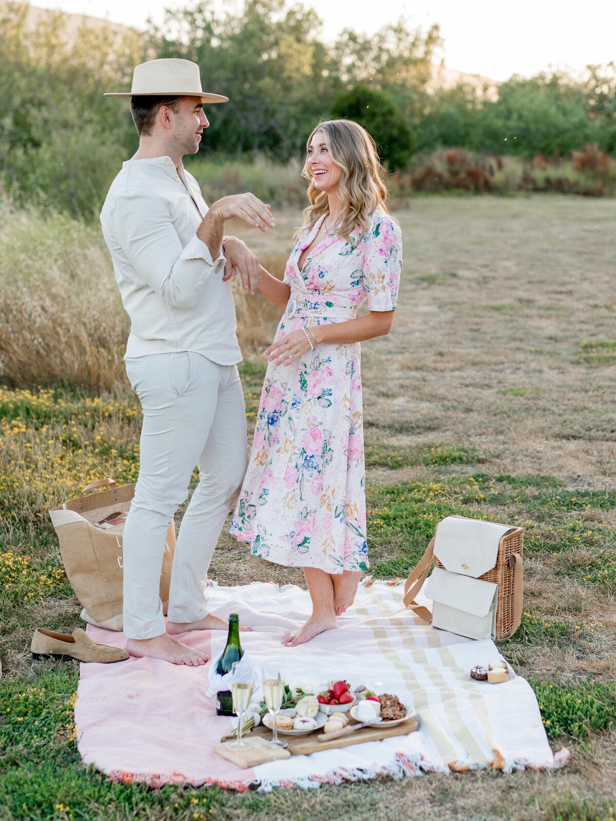 Playful engagement picnic in San Luis Obispo—barefoot laughs and sweet golden hour vibes.
