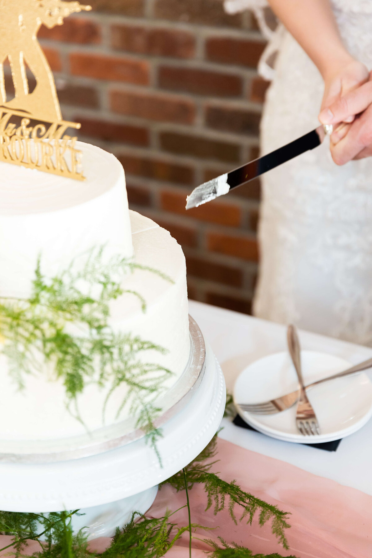Cake cutting at Fat Bottom Brewery wedding reception in Nashville, TN