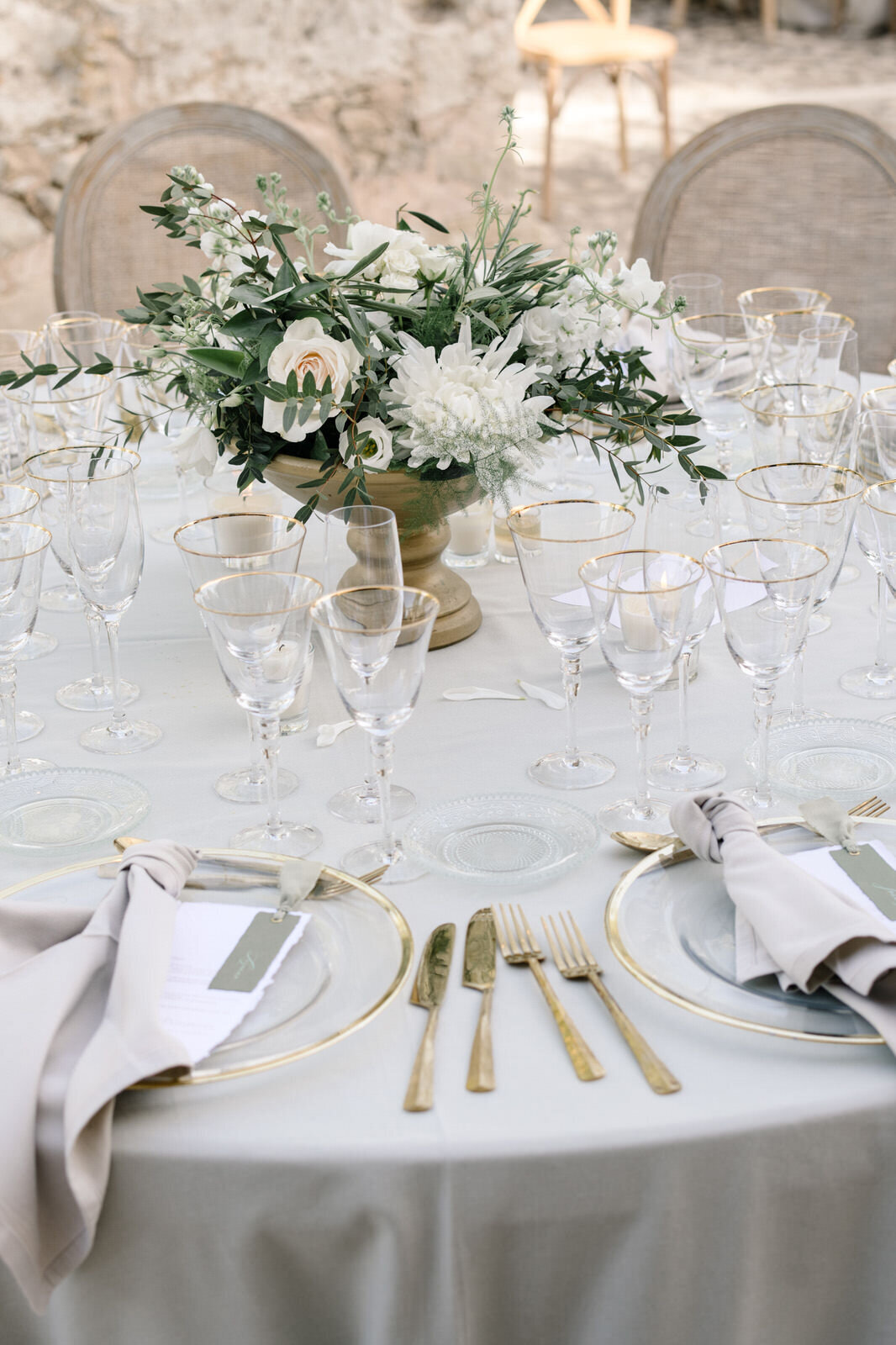 elegant white green and gold wedding table setting in mallorca