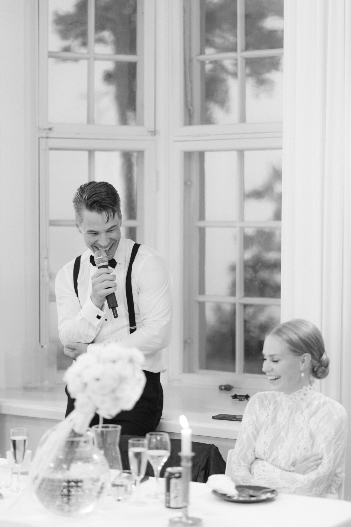 Documentary wedding photograph of the groomg  giving a speech to the bride in Airisniemi manor in Turku, Finland. Atmosphere captured by wedding photographer Hannika Gabrielsson.