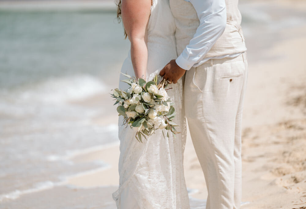 a close up of a white wedding bouquet in Cozumel