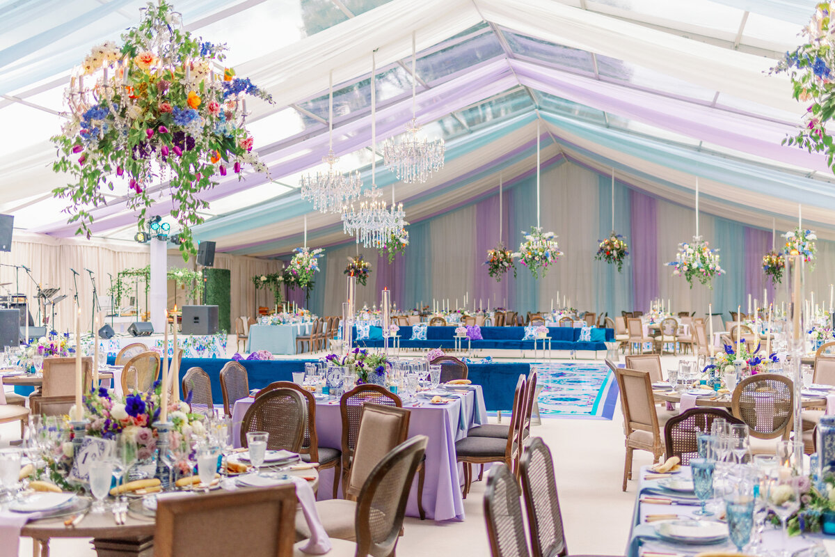 A colorful tented wedding reception decor