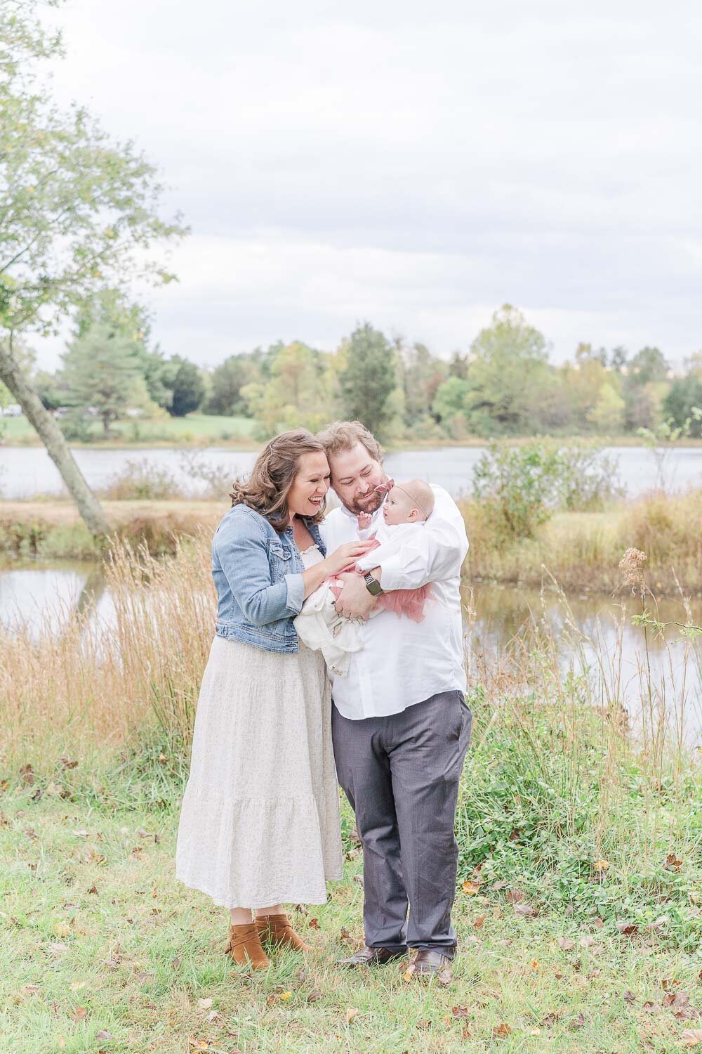 parents playing with baby during Warrenton, VA fall mini session