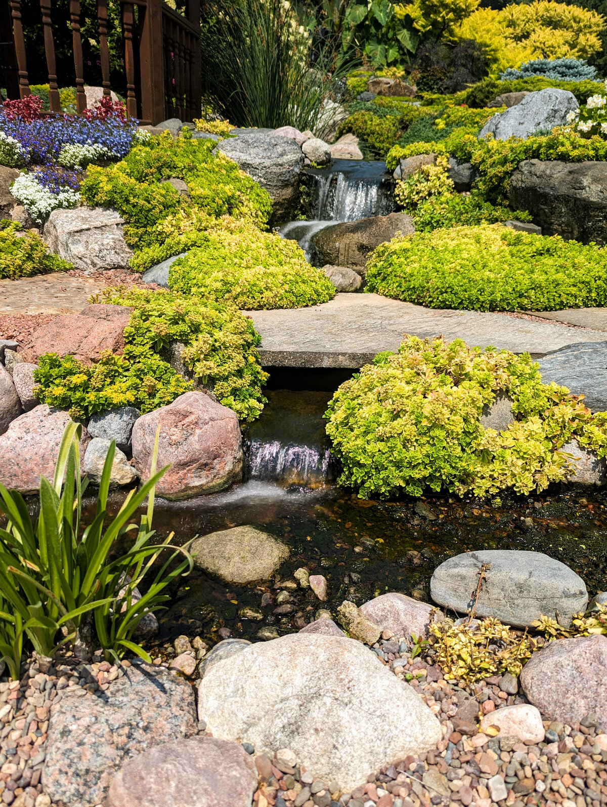 Waterfalls with natural stone bridge for a Japanese water garden feel