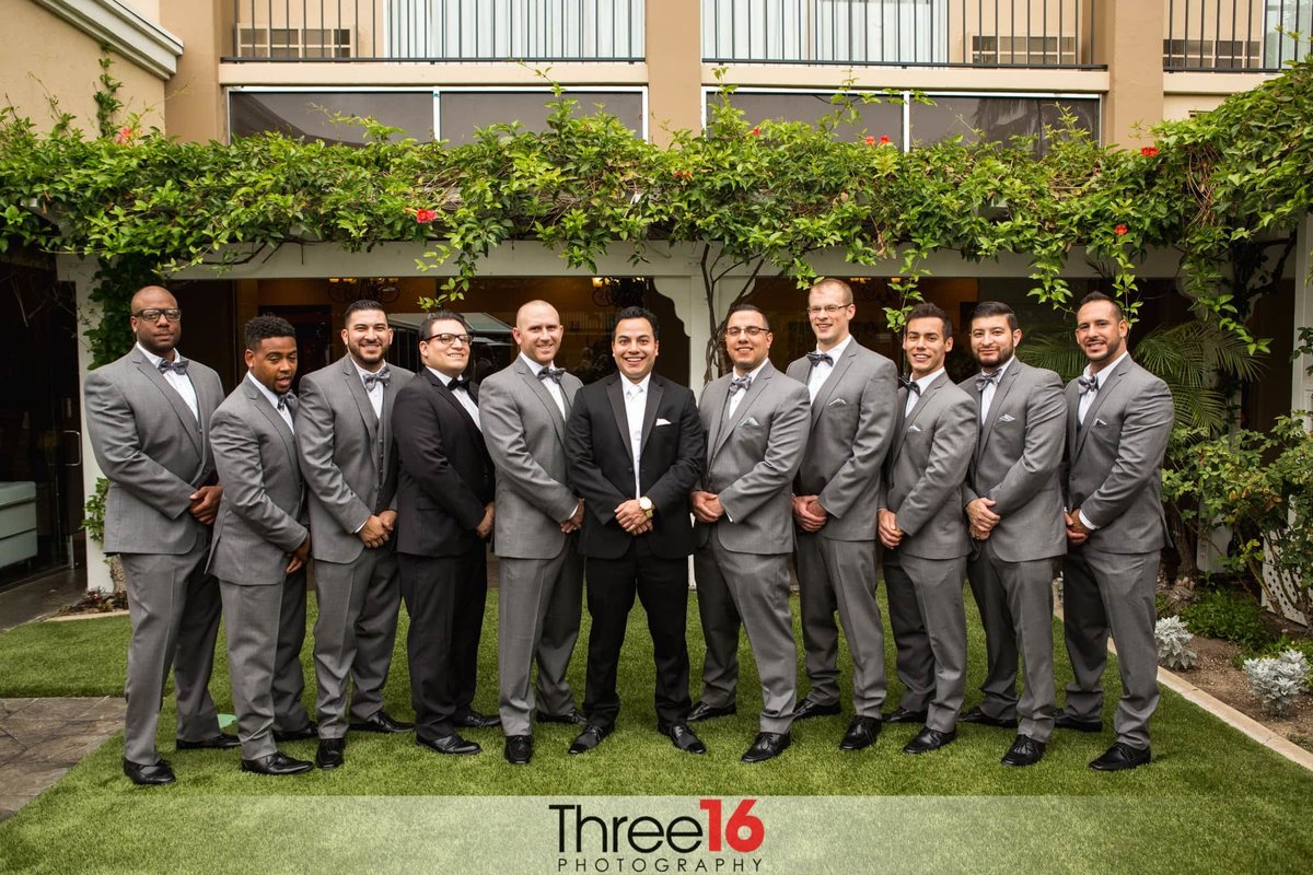 Groom and his Groomsmen pose for the wedding photographer