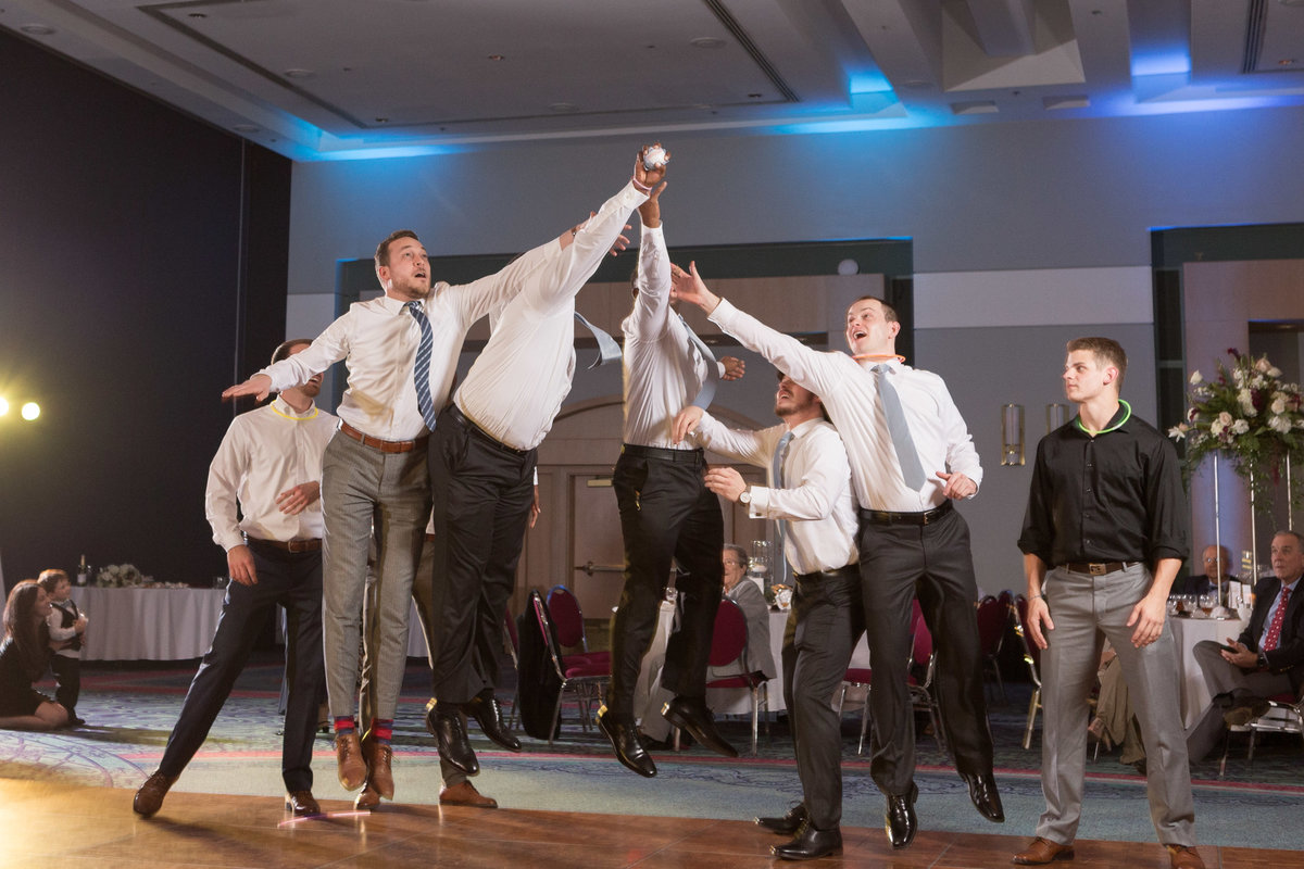 Meghan & Austin Dean garter toss at their wedding reception at The Mobile Convention Center in downtown Mobile, Alabama.