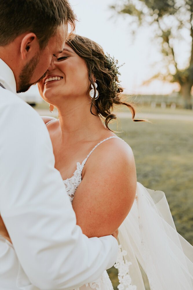 bride-groom-golden-hour-closeup-romantic-kiss-iowa-storyteller-collective-photo-co