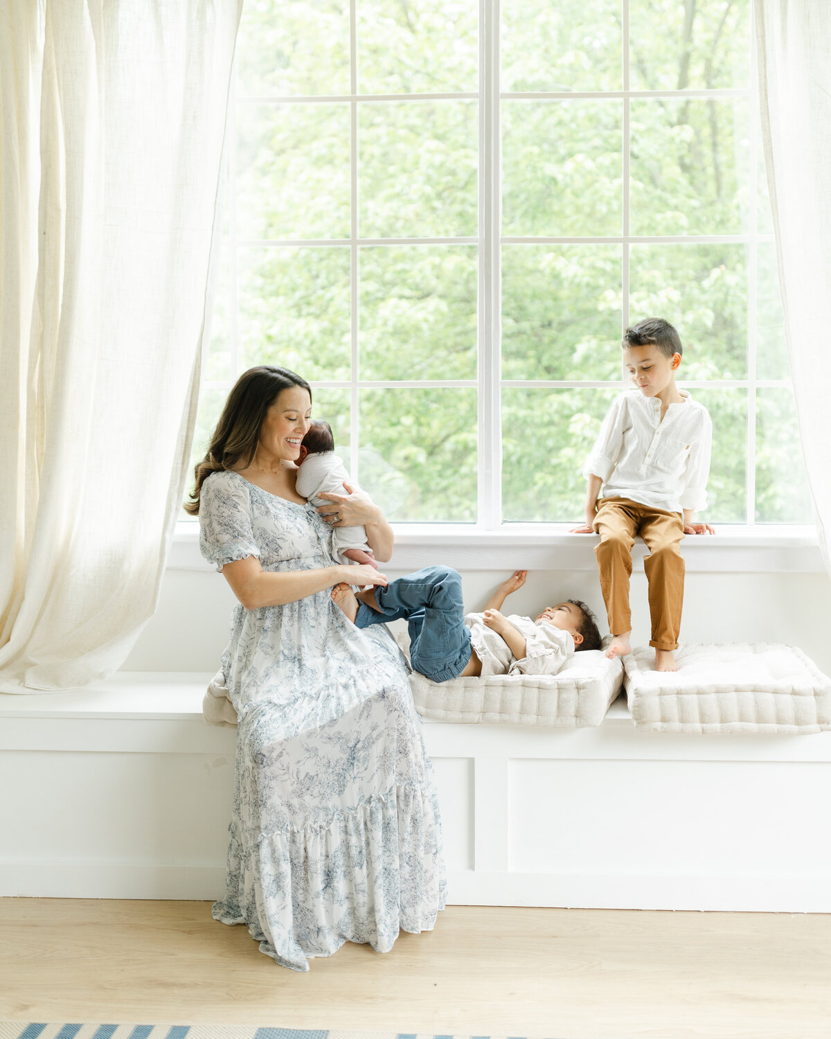 Newborn photography session with siblings at a Philadelphia photography studio - 10