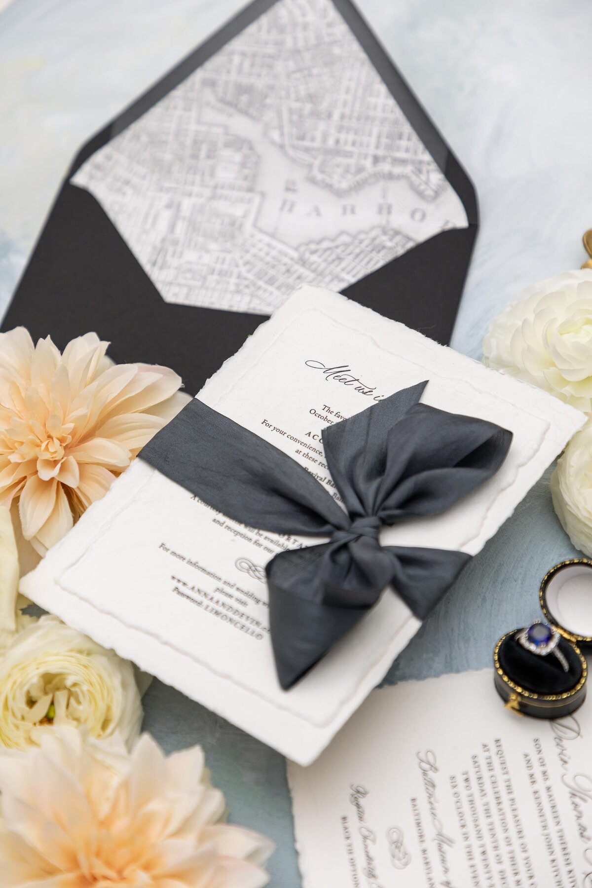 wedding invitation suite with black and white detailing and black silk ribbon