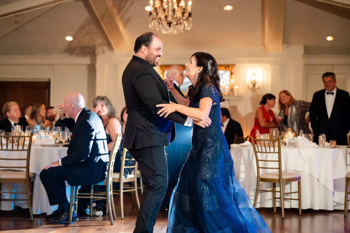 groom dancing with mom wedding photo