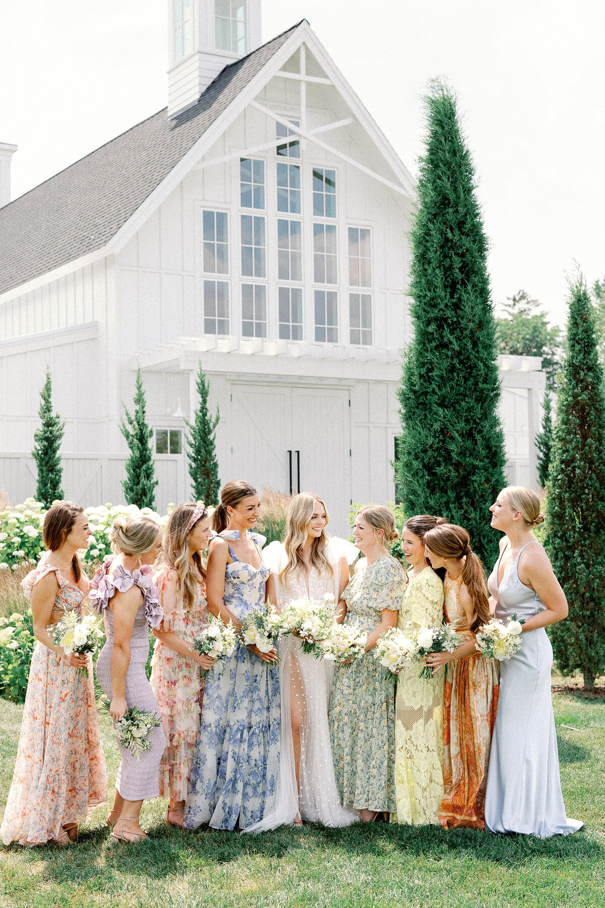 Mismatched bridesmaid dresses summer wedding at a vineyard