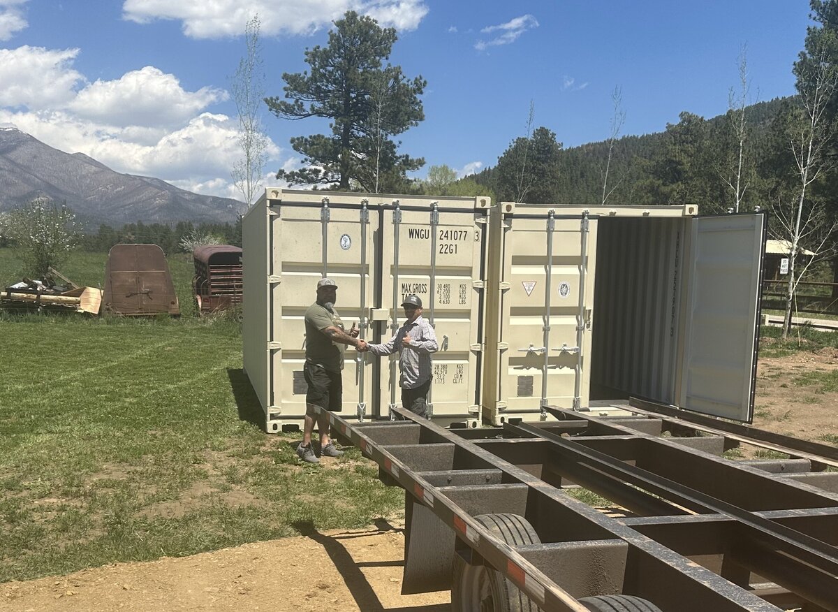 GSC owner with happy client at shipping container delivery in New Mexico