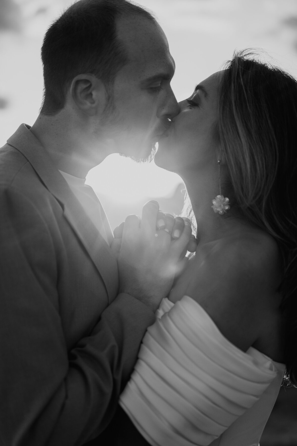 romantic couple kissing during twilight elopement in Dolomites