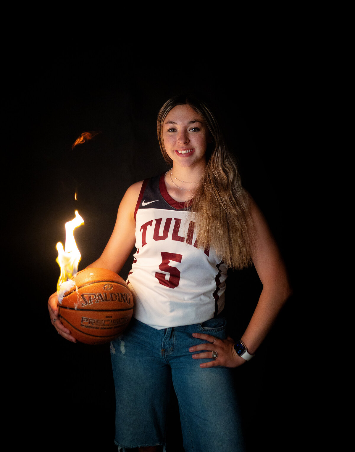In studio session with high school varsity basketball player while the ball is on fire.