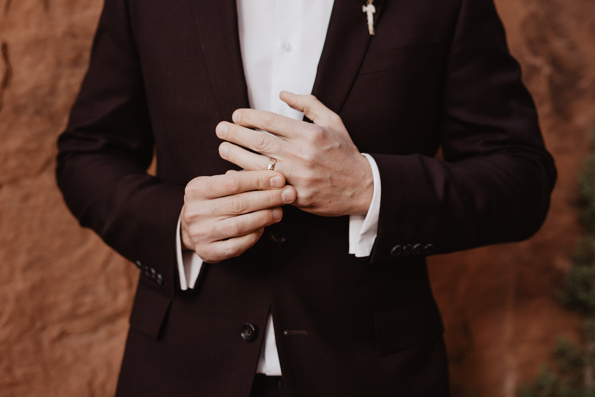 Utah elopement photographer captures groom adjusting ring