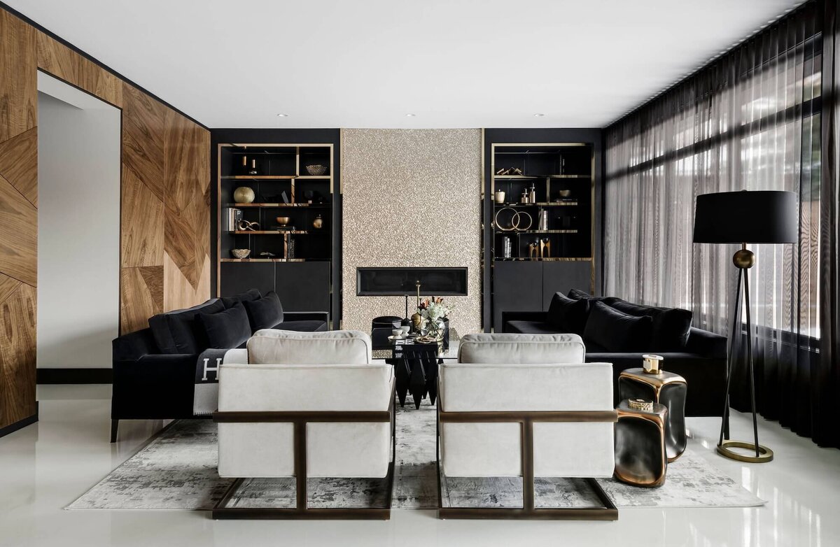 A luxe living room paired with walnut, metallic and sparkling tile and brass and gold features. 