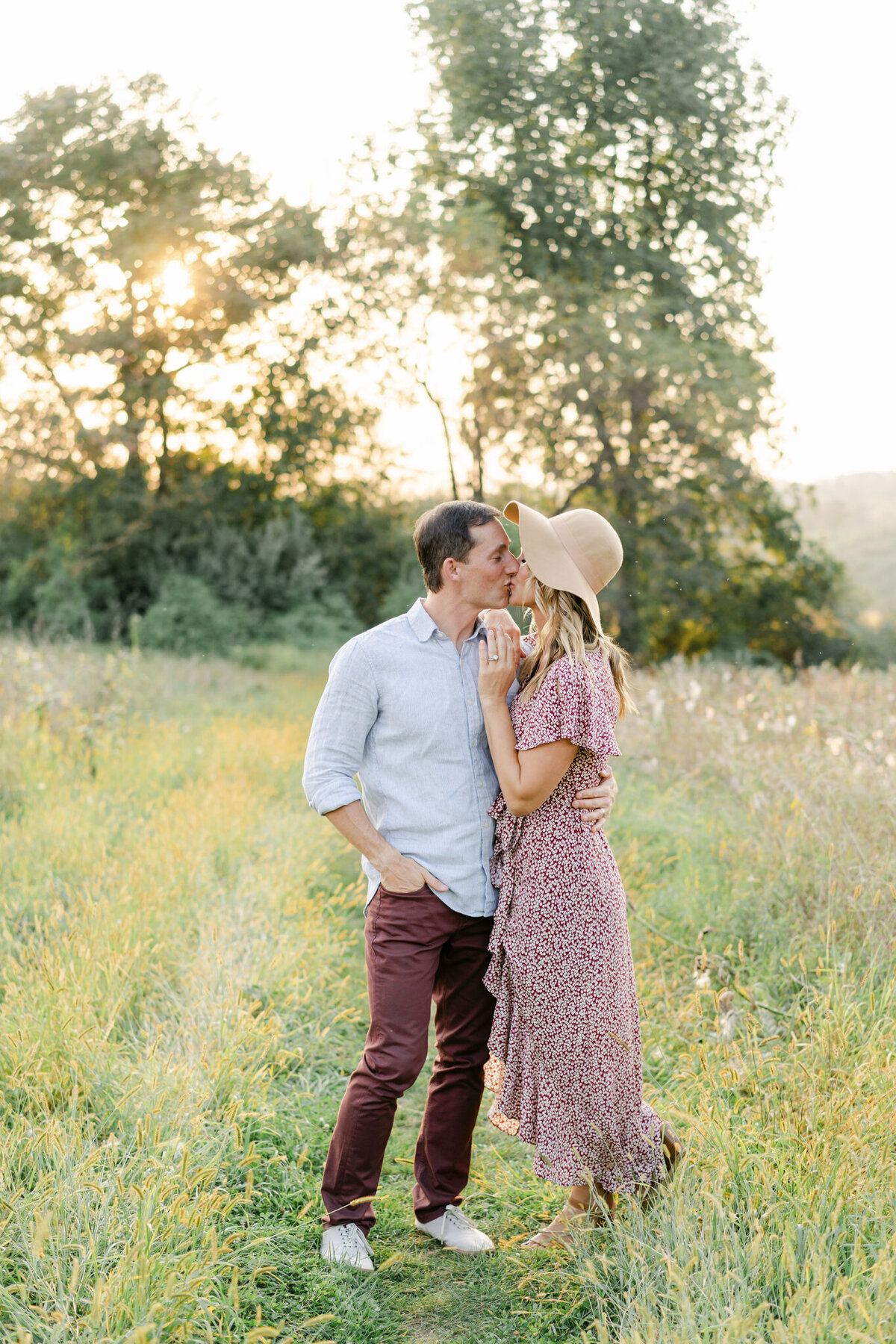 Couple Kiss in a field of tall grass outside of Philadelphia, PA