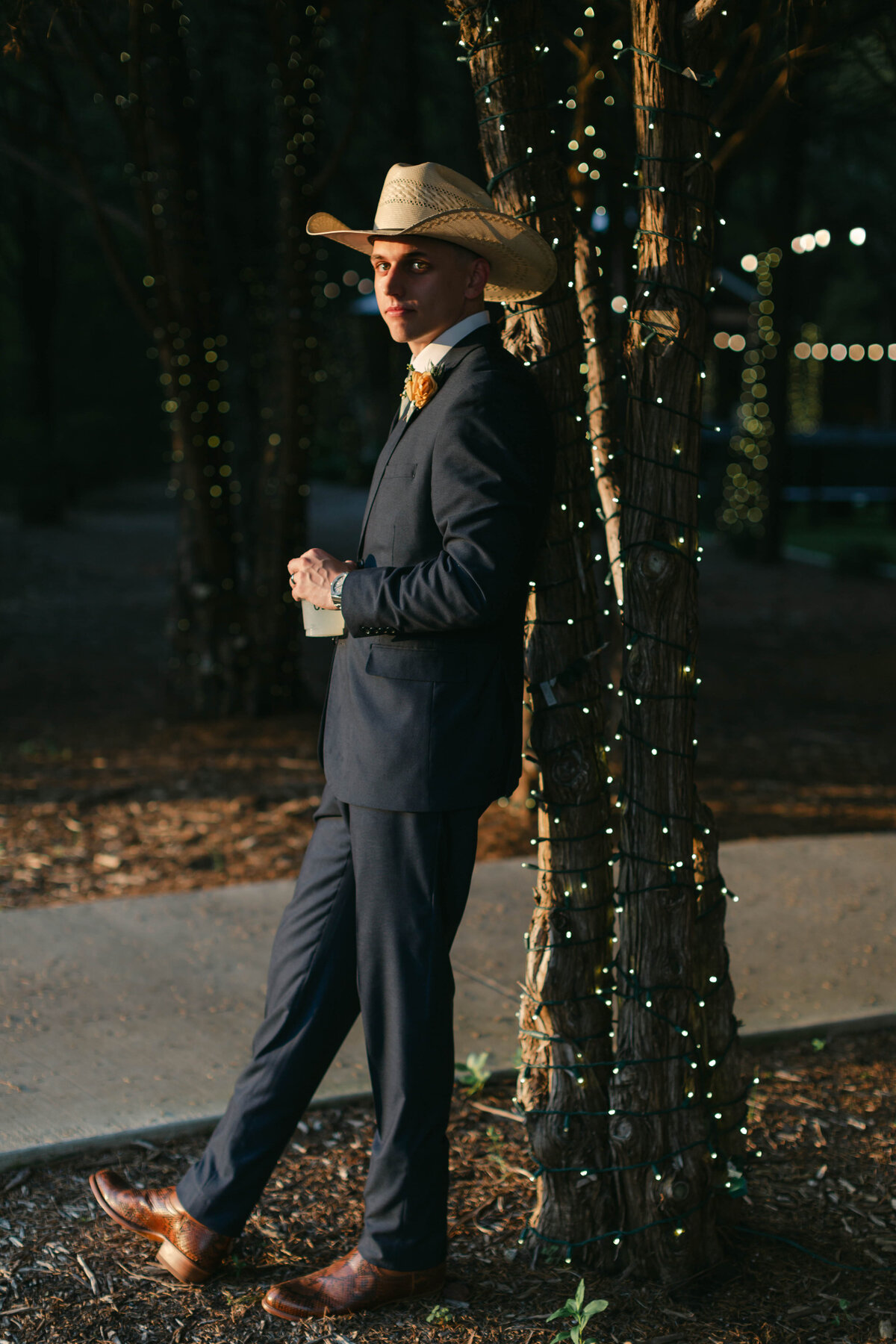 groom wearing a cowboy hat