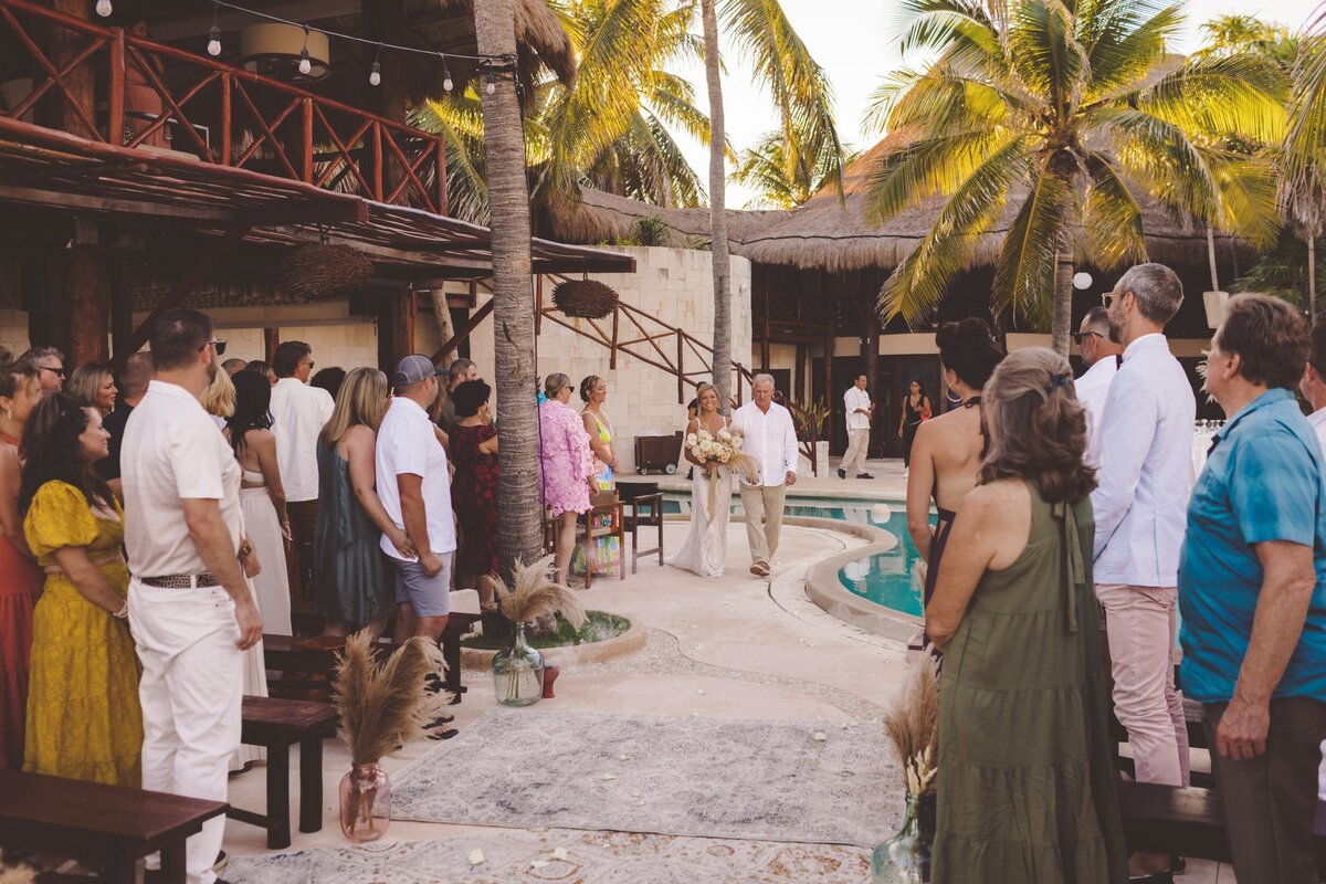 Bride walking down the aisle at viceroy riviera maya wedding