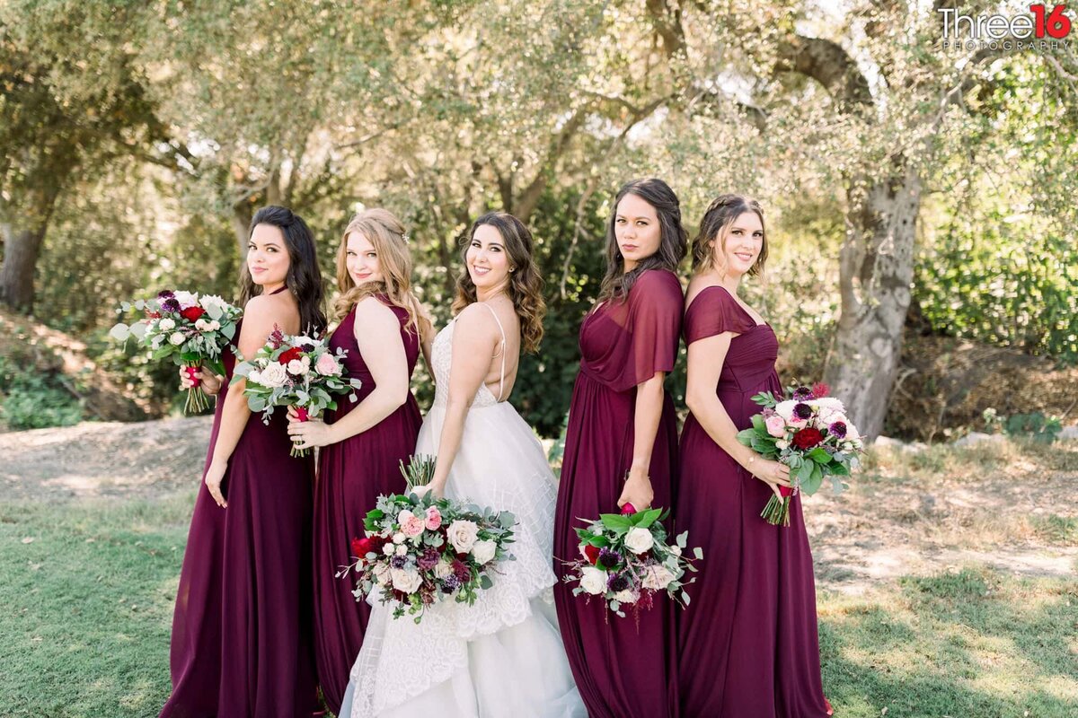 Bride poses with her Bridesmaids