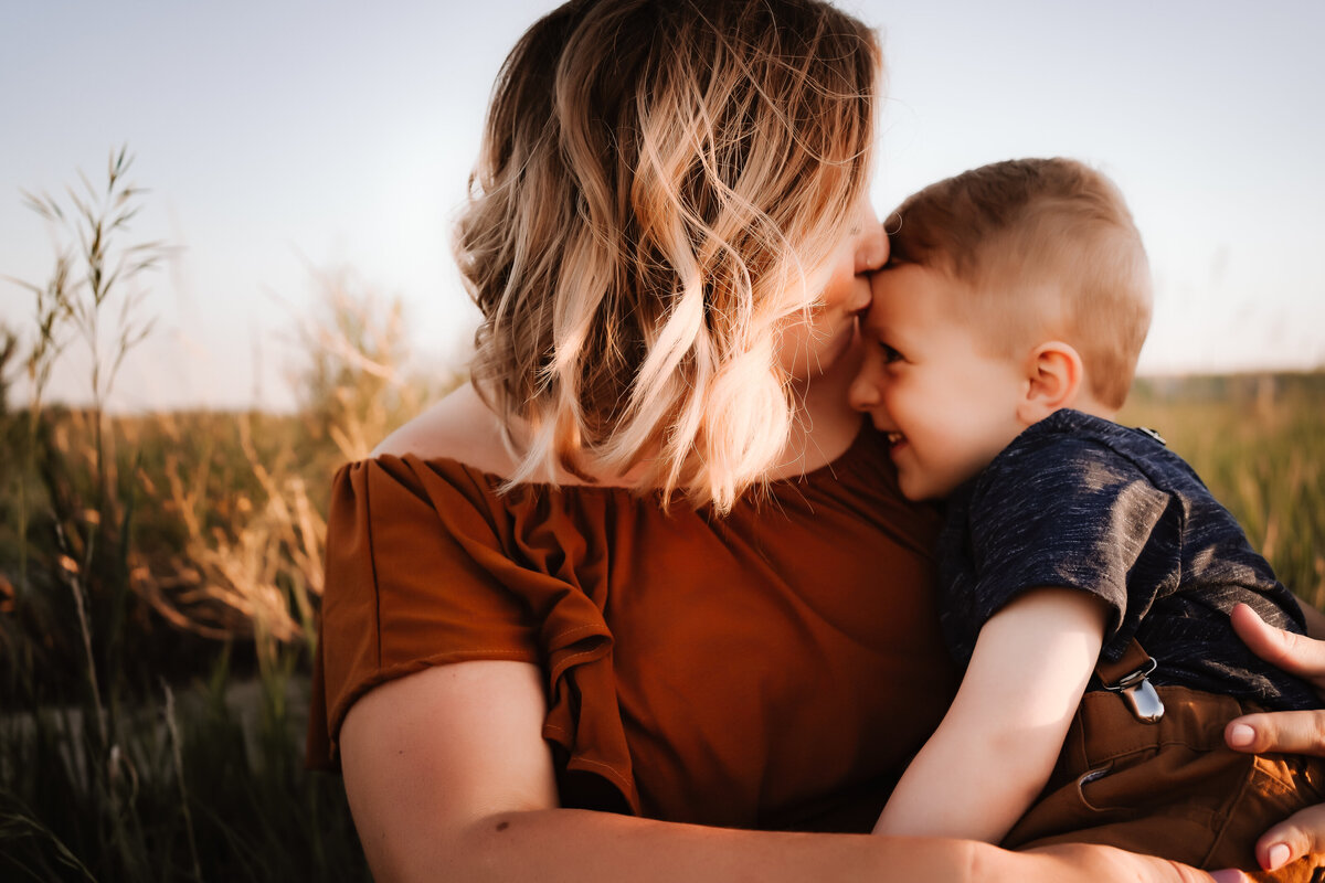 motherhood kiss sunset
