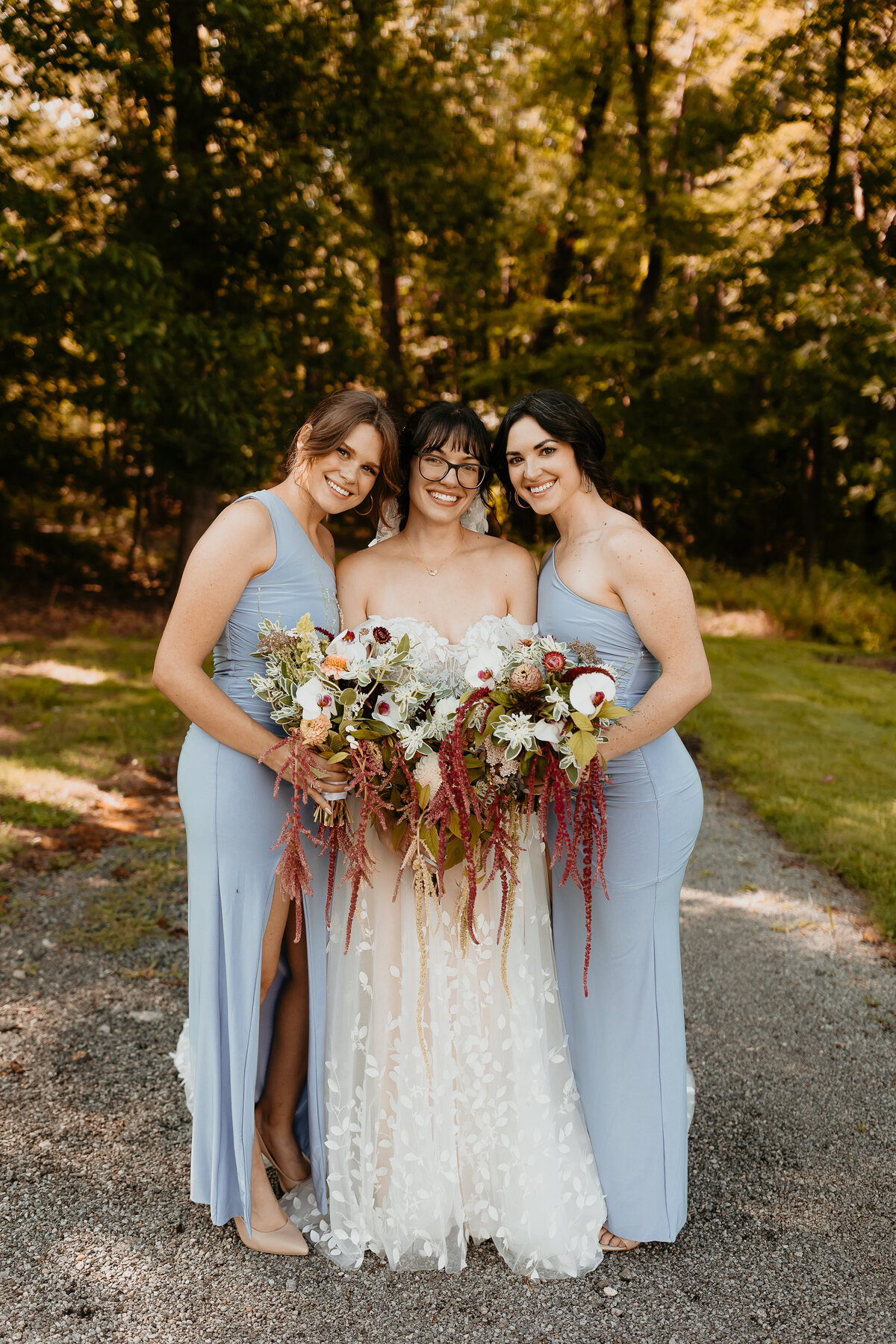 Bride smiling with Bridesmaids