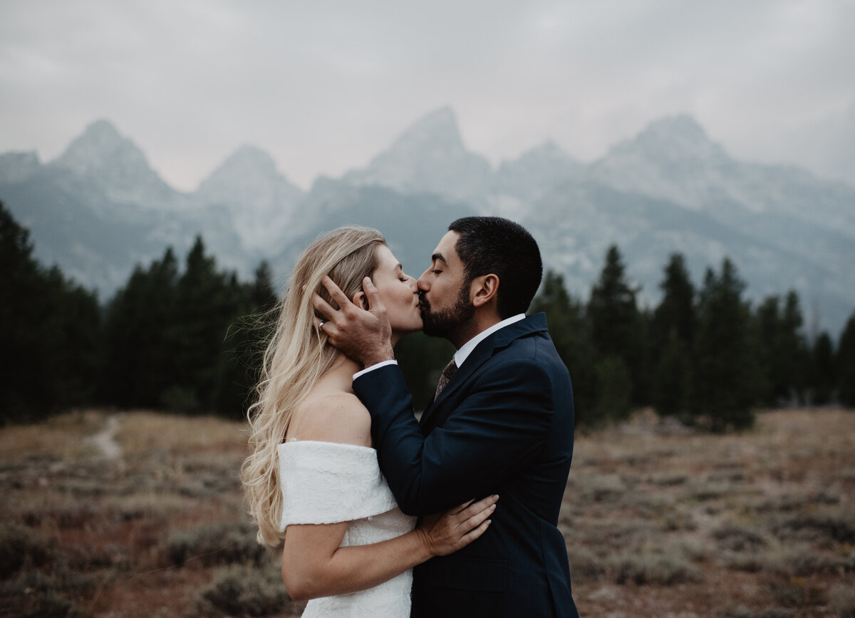 Photographers Jackson Hole capture couple kissing in Grand Teton National Park