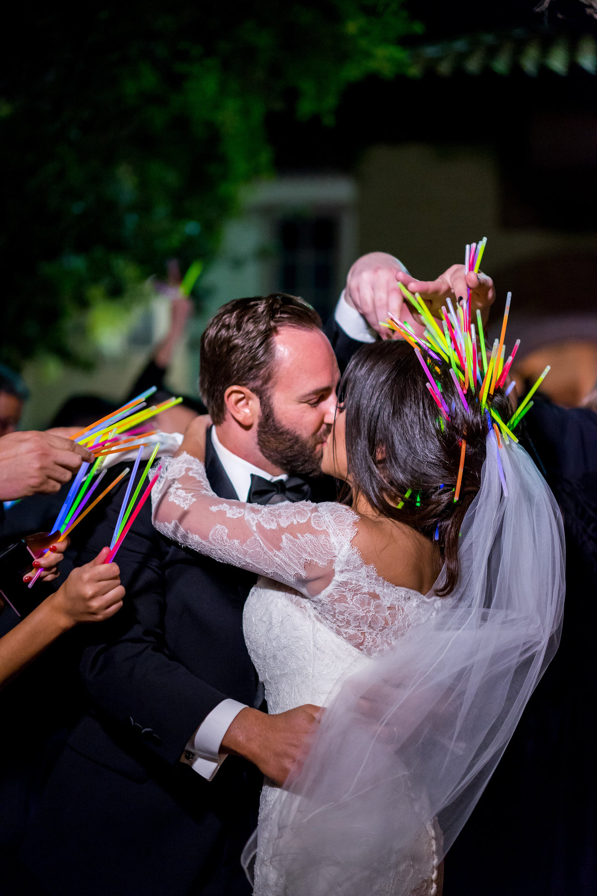 Bride and groom exit wedding reception with glow sticks grand departure at The Witten Museum venue