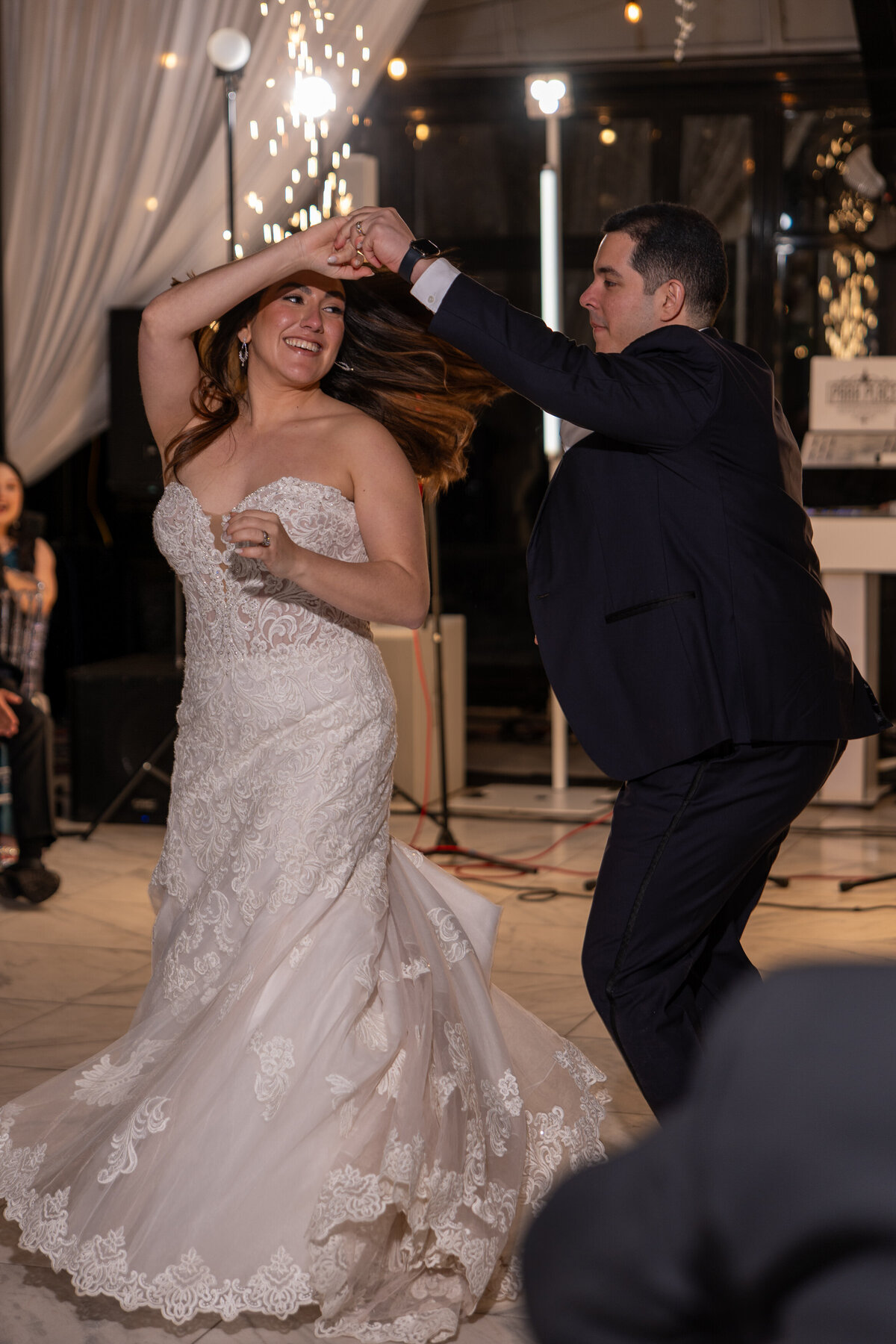 a newlywed couple dancing at their wedding reception 