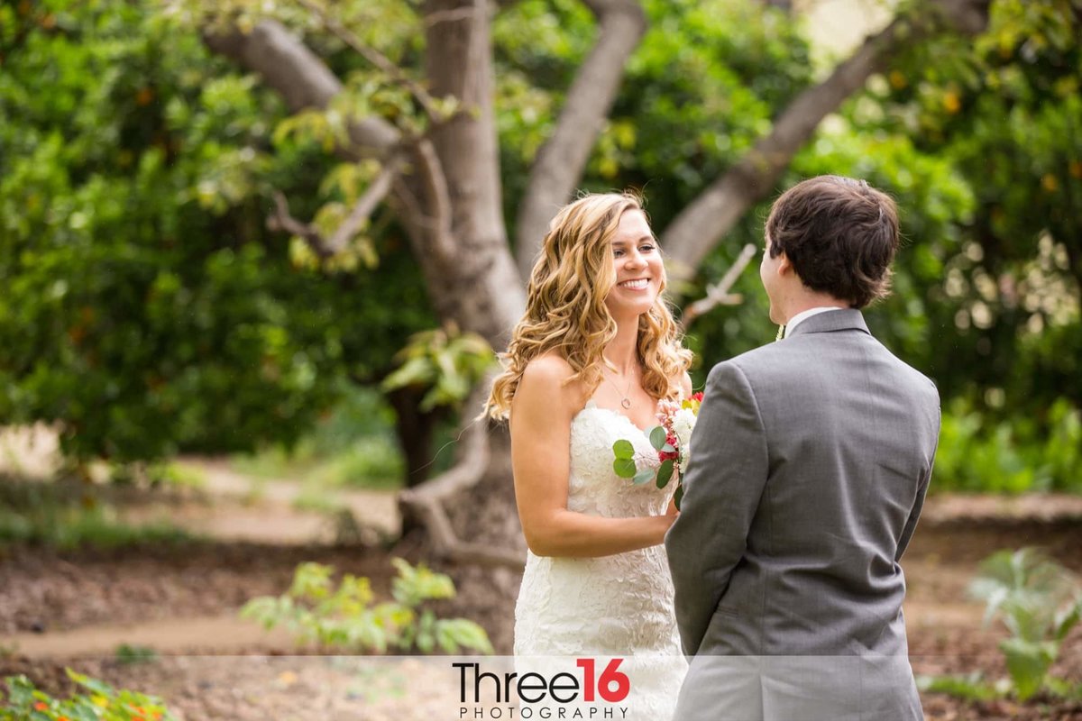 Bride shares a big smile at her Groom during photo session