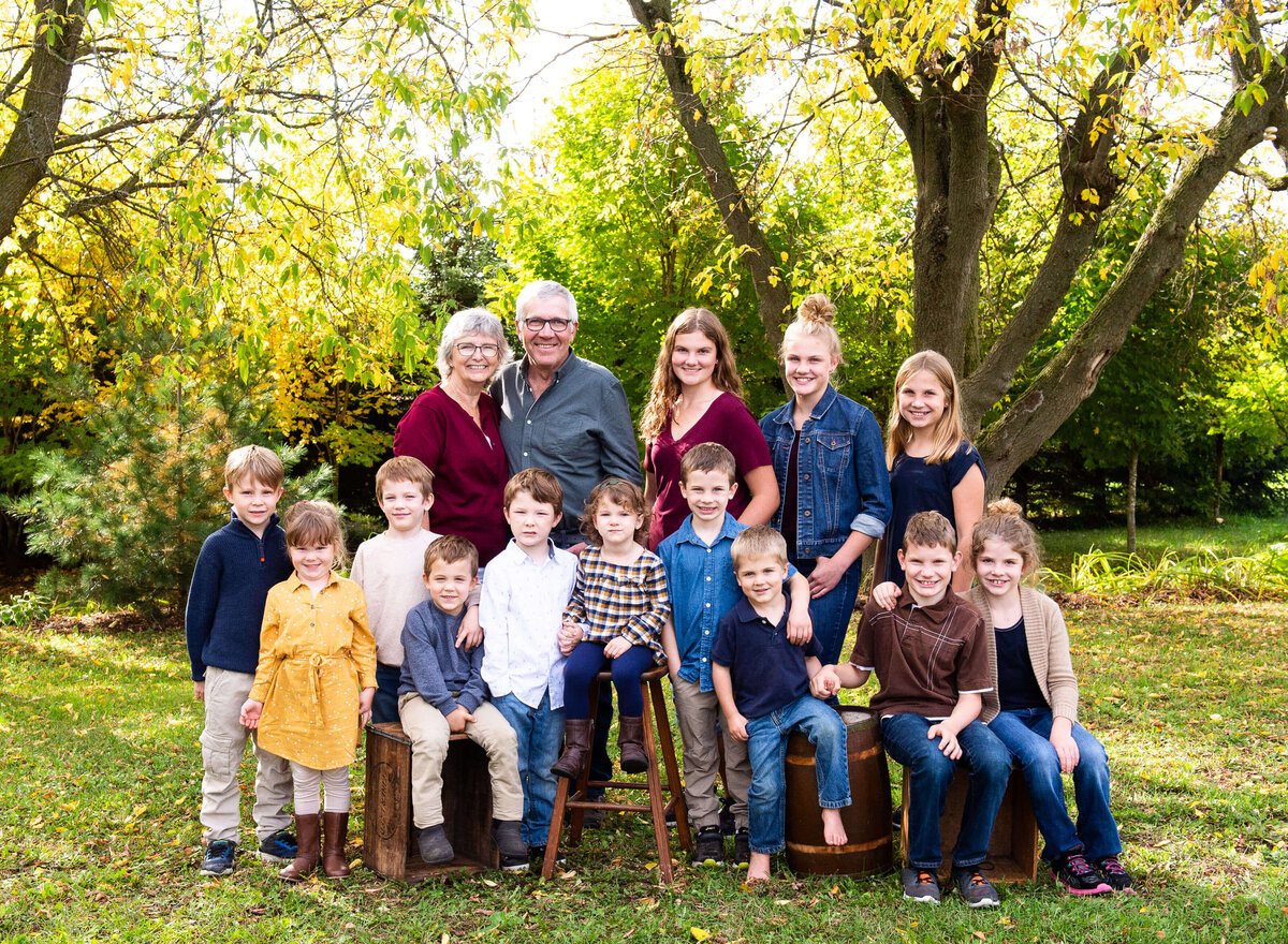 a photo of Grandparents with all their grandchildren taken during their Ottawa family photography session with JEMMAN Photography