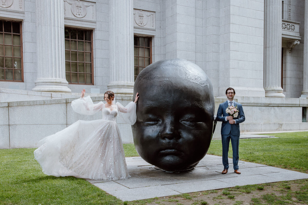 A posed, editorial portrait of the bride and groom — taken outside the Museum of Fine Arts, Boston
