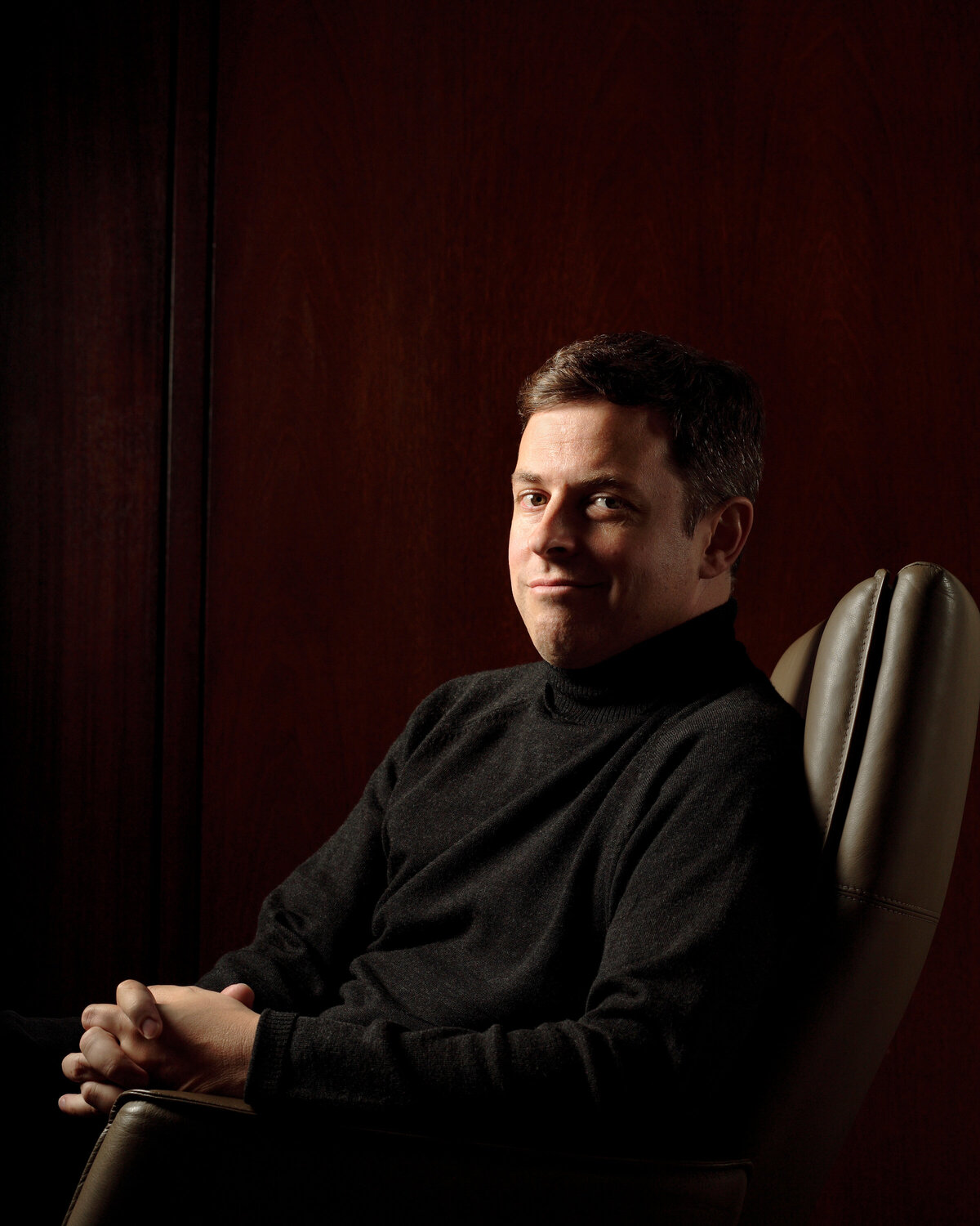 A man sitting in a leather chair