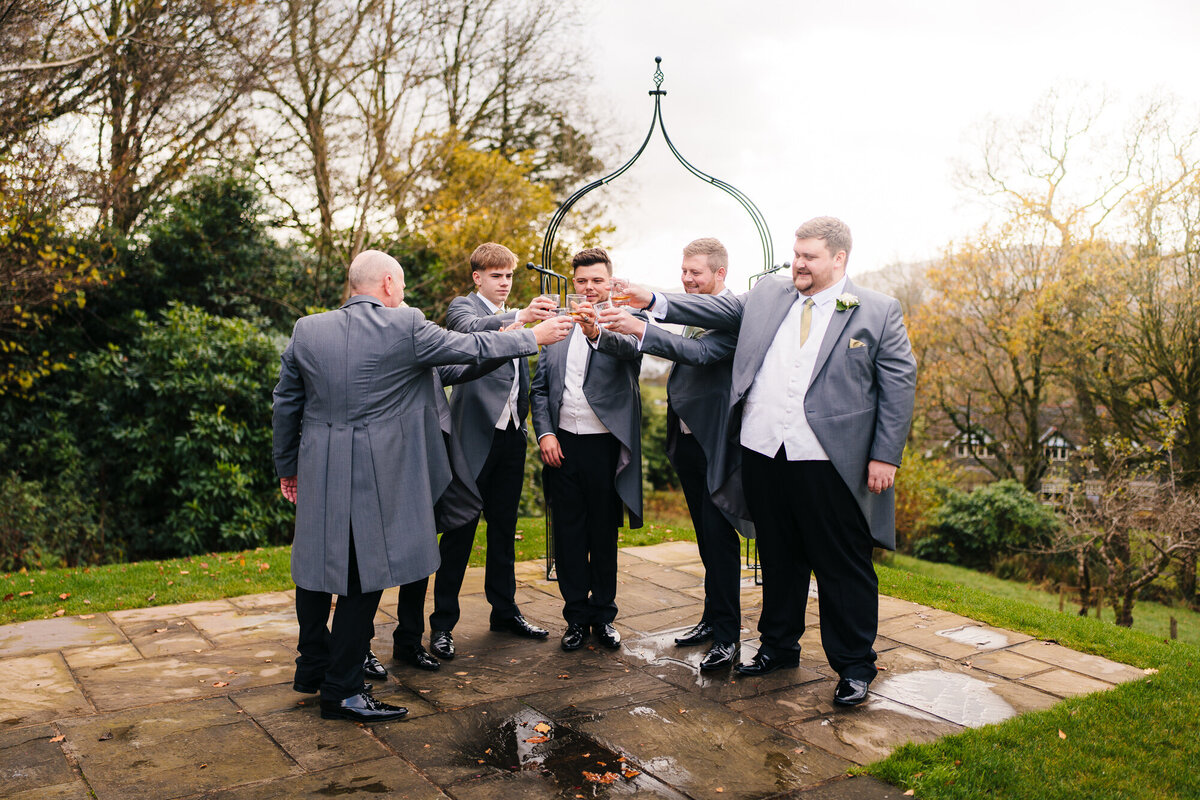 Groomsman cheering looking out over the lake windermere takne by Anthony Horseman Photography and Film