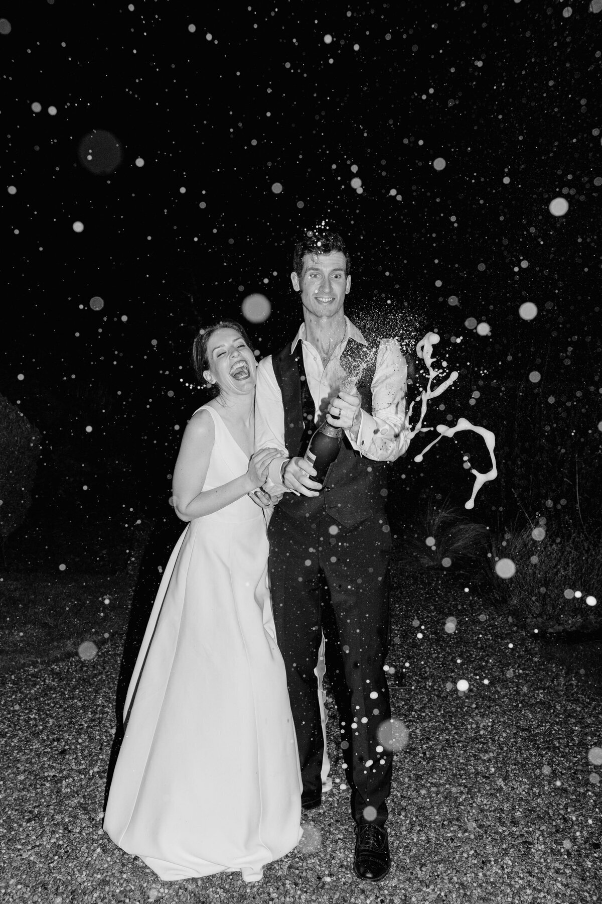 chmpagne-pop-black-white-night-wedding-photo